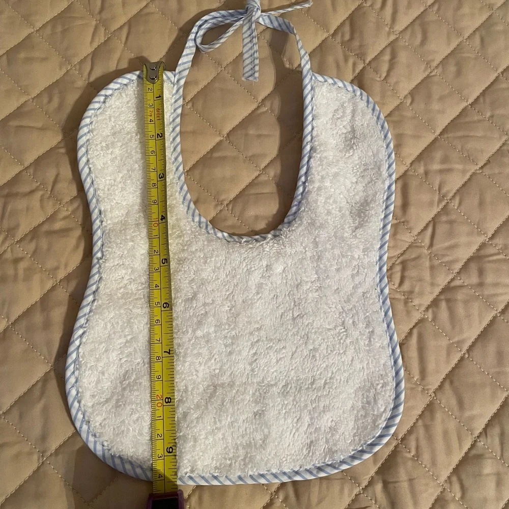 Handmade Bib white with blue trim, tie closure, brand new.